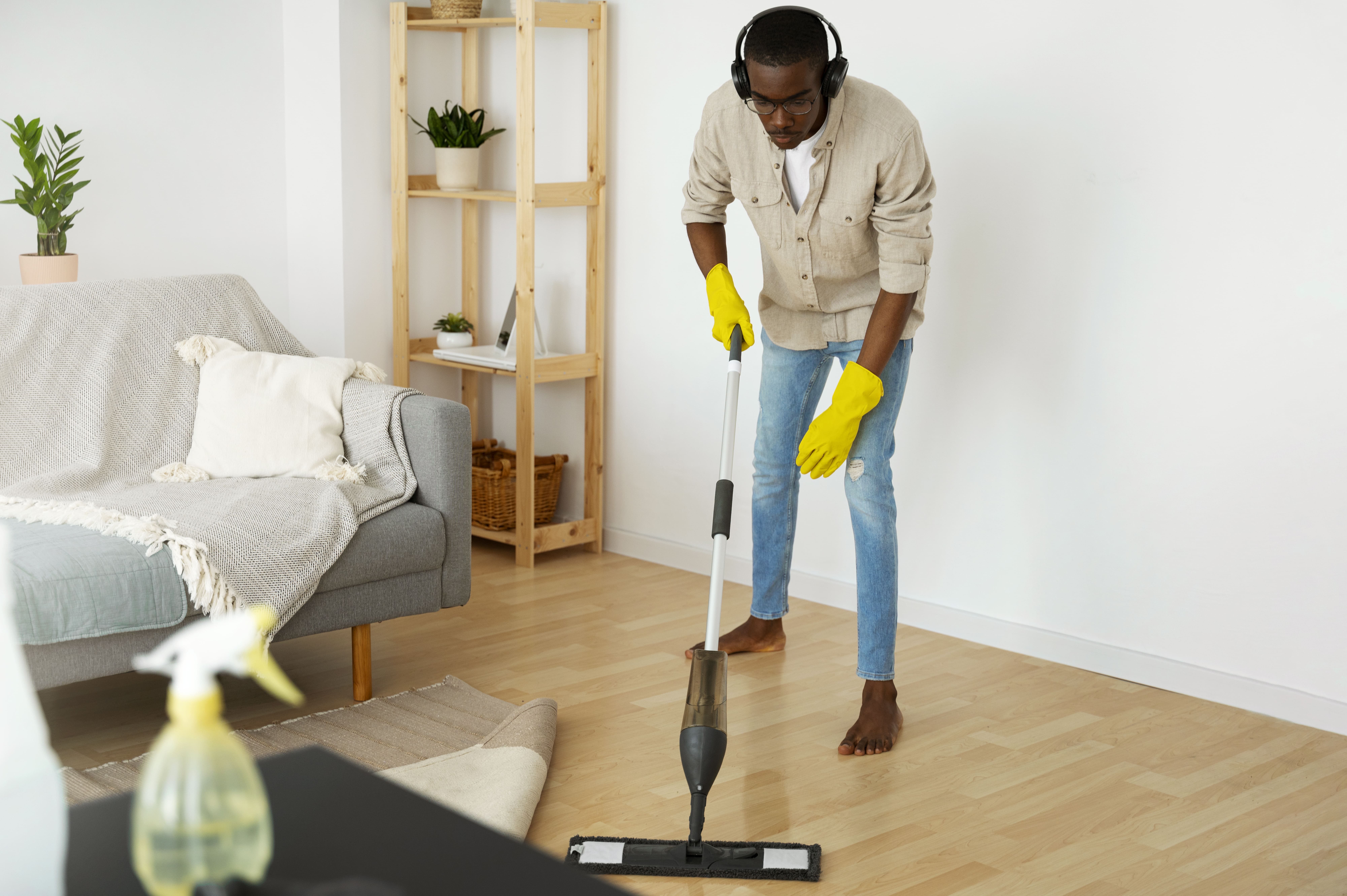 man cleaning his house