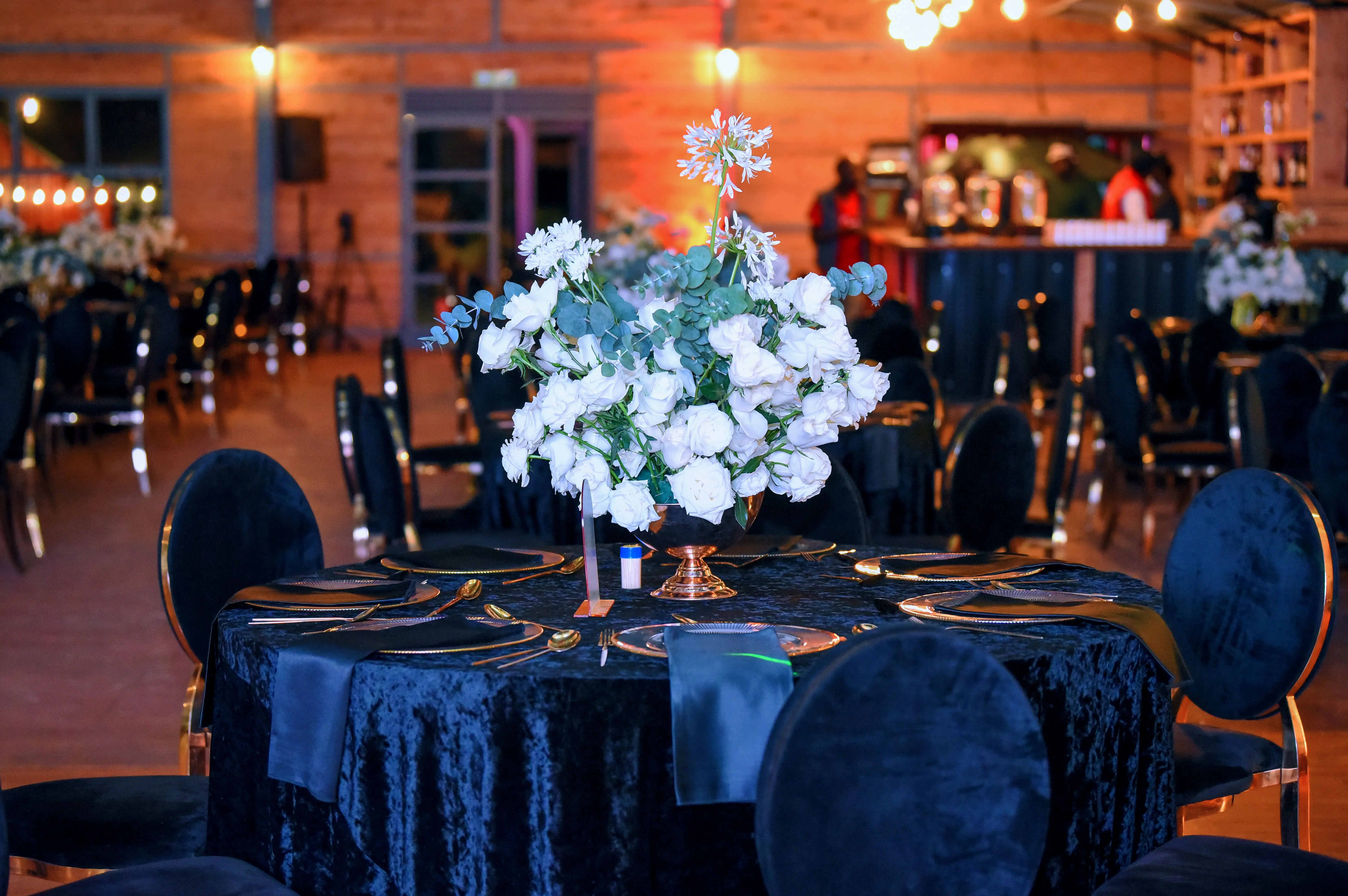Luxurious buffet table with African cuisine, candles, and elegant decorations for a sophisticated event