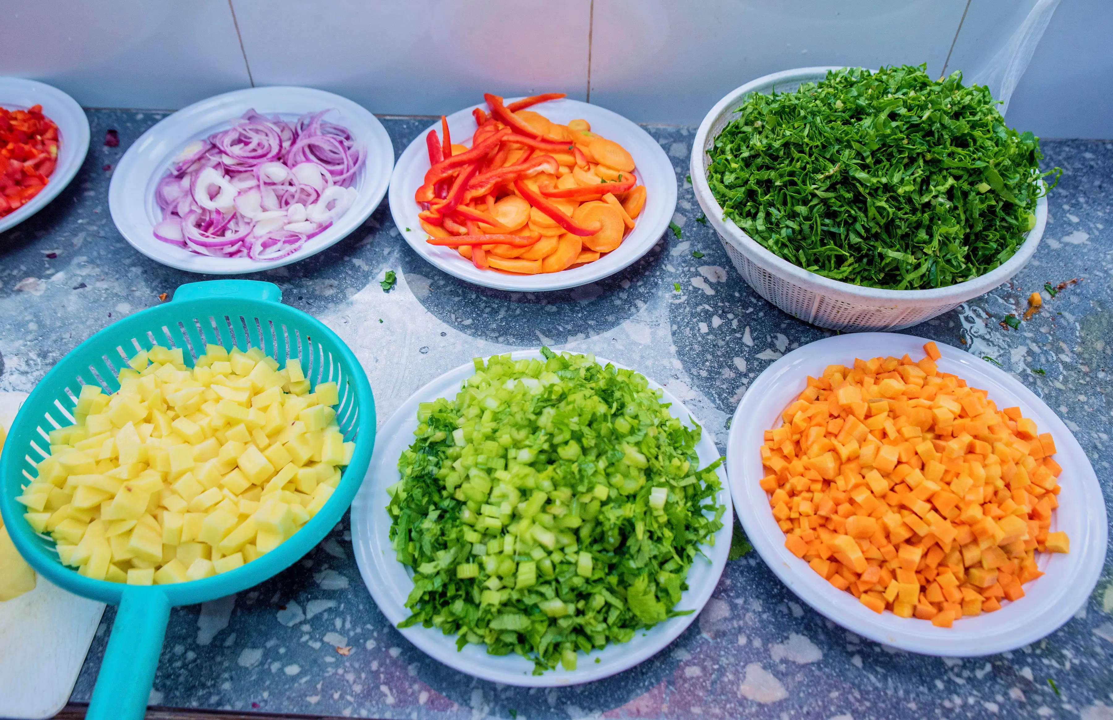 Professional chef preparing authentic African cuisine in a modern kitchen